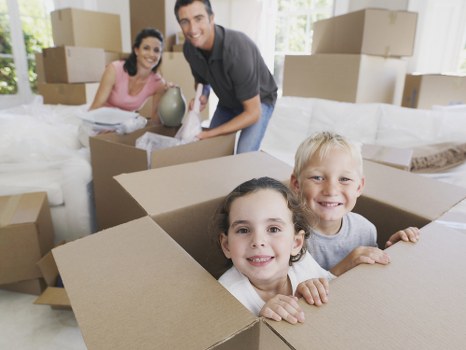 Organized household storage solutions in Stratford with stacked boxes and furniture
