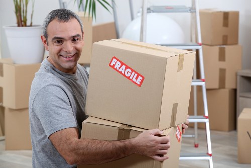 Professional house removals in Stratford with moving van and packed boxes