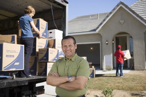 Packed boxes and furniture stored securely in a Stratford storage unit