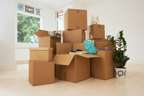 Professional packers handling fragile items during a local move